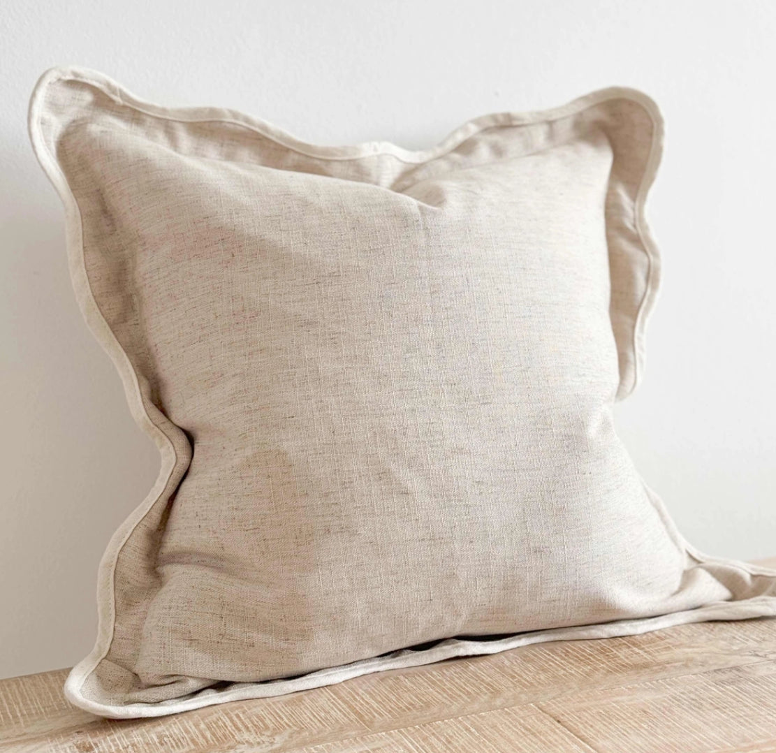Scalloped neutral linen cushion